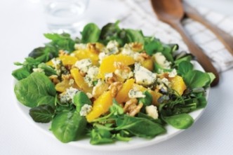 Orange salad with nuts and molded cheese